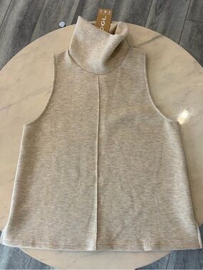 OGL Fuzzluxe Sleeveless Split Hem Turtleneck Top.
